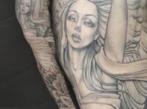 single needle black and grey angel face tattoo
