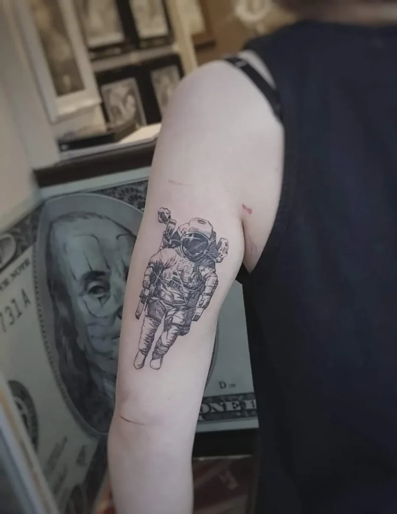 fine line astronaut tattoo