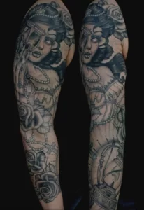 black and grey neotraditional girl head tattoo